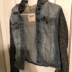 Jean jacket with sweater sleeves and hood.